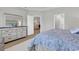 Comfortable main bedroom with a king bed, ensuite bathroom, and plush white rug at 4061 Taranto Loop # A, Myrtle Beach, SC 29579