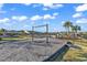 Community playground with swings and play structure, surrounded by lush greenery and a clear blue sky at 4061 Taranto Loop # A, Myrtle Beach, SC 29579