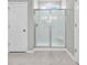 Modern glass-enclosed shower with bright tile and a built-in seat at 4061 Taranto Loop # A, Myrtle Beach, SC 29579
