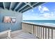 Relaxing balcony with a beautiful ocean view, beach chairs, and a comfortable lounge chair at 410 N Waccamaw Dr. # 306, Murrells Inlet, SC 29576