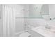 Full bathroom with shower-tub combo, modern fixtures and a white vanity at 410 N Waccamaw Dr. # 306, Murrells Inlet, SC 29576