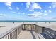 Private beach access walkway with scenic ocean views and a sandy path to the shore at 410 N Waccamaw Dr. # 306, Murrells Inlet, SC 29576