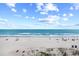 Picturesque beach view with a wide sandy shore, gentle waves, and scattered beachgoers enjoying the scenery at 410 N Waccamaw Dr. # 306, Murrells Inlet, SC 29576