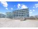 Stunning multi-story oceanfront condo building with private balconies and easy beach access at 410 N Waccamaw Dr. # 306, Murrells Inlet, SC 29576
