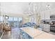 Open-concept living area with ocean views, stylish furniture, and access to a private balcony at 410 N Waccamaw Dr. # 306, Murrells Inlet, SC 29576