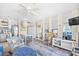 Well-decorated living room with a kitchen view, mirrored walls, and stylish furniture at 410 N Waccamaw Dr. # 306, Murrells Inlet, SC 29576
