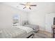 Bright bedroom features two beds, a ceiling fan, and a window offering ample natural light at 422 Harbour View Dr., Myrtle Beach, SC 29579