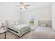 Cozy bedroom featuring two twin beds, a ceiling fan, and a bright window at 422 Harbour View Dr., Myrtle Beach, SC 29579