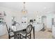 Bright dining room with a modern table setting connecting to kitchen and living area at 422 Harbour View Dr., Myrtle Beach, SC 29579