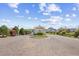 Welcoming community entrance with a decorative roundabout, lush landscaping, and a secure gate at 422 Harbour View Dr., Myrtle Beach, SC 29579