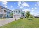 Charming two-story home boasting light blue siding, white trim, a well-manicured lawn, and attached garage at 422 Harbour View Dr., Myrtle Beach, SC 29579