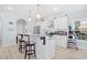 Well-lit kitchen featuring an island with bar stool seating, stainless steel appliances, and white cabinetry at 422 Harbour View Dr., Myrtle Beach, SC 29579
