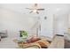Inviting living room features a ceiling fan, staircase, and a cozy seating area at 422 Harbour View Dr., Myrtle Beach, SC 29579