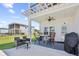 Covered patio with ceiling fan and outdoor seating, perfect for relaxing and entertaining at 422 Harbour View Dr., Myrtle Beach, SC 29579