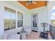 Covered porch with seating and an exercise bike, offering a relaxing outdoor space at 422 Harbour View Dr., Myrtle Beach, SC 29579