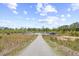 Gated boat and trailer storage facility surrounded by a chain link fence and greenery at 422 Harbour View Dr., Myrtle Beach, SC 29579