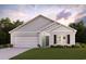 Charming single-story home featuring a two-car garage, manicured lawn, and a classic craftsman-style facade at 447 Sw Hewett Landing Dr., Supply, SC 28462