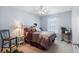 Comfortable bedroom with ceiling fan, soft carpet, and ample natural light at 466 Wampee St. Nw, Calabash, NC 28467