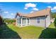 A side view of home featuring an enclosed porch, lush green grass and lots of sunlight at 466 Wampee St. Nw, Calabash, NC 28467