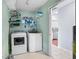 Functional laundry area with washer, dryer, and shelving for storage at 466 Wampee St. Nw, Calabash, NC 28467