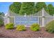 Community entrance sign for Ocean Side Place with manicured landscaping at 466 Wampee St. Nw, Calabash, NC 28467