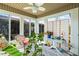 Inviting sunroom filled with natural light, comfortable seating, a ceiling fan, and views of the outdoors at 466 Wampee St. Nw, Calabash, NC 28467