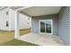 Covered back patio with grey siding, a concrete floor, and sliding glass doors at 500 Scarlet Sage Dr., Conway, SC 29527