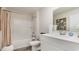 Bright bathroom featuring a shower-tub combo with a crisp white vanity and complementary decor at 500 Scarlet Sage Dr., Conway, SC 29527