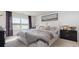 Comfortable bedroom with ample natural light, soft textures, and stylish accents at 500 Scarlet Sage Dr., Conway, SC 29527