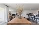Open dining area with wood table and view of the living room with a view of the patio at 500 Scarlet Sage Dr., Conway, SC 29527
