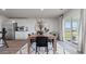 Dining area features a wooden table with seating for six with modern décor and view of the backyard at 500 Scarlet Sage Dr., Conway, SC 29527