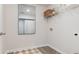 Functional laundry room with mirrored wall decor, wire rack shelving, and washer hookups at 500 Scarlet Sage Dr., Conway, SC 29527