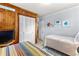 Inviting bedroom with paneled wall and twin beds, perfect for relaxing stays at 505 19Th Ave. S, North Myrtle Beach, SC 29582
