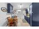 Bright kitchen with wood table, dark cabinets, and modern appliances, offering ample space for dining and meal preparation at 505 19Th Ave. S, North Myrtle Beach, SC 29582