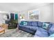 Inviting living area with a large sectional sofa, plenty of natural light, and a view into the adjacent kitchen at 505 19Th Ave. S, North Myrtle Beach, SC 29582