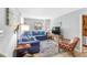Cozy living area with plush seating, bright windows, and an adjacent kitchen area at 505 19Th Ave. S, North Myrtle Beach, SC 29582