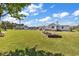 Expansive backyard featuring a playset, garden beds, and plenty of space for outdoor activities and gardening at 5086 Highway 319 E, Conway, SC 29526