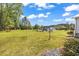 Large backyard with mature trees and shed at 5086 Highway 319 E, Conway, SC 29526