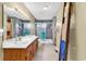 Bathroom featuring double sinks, a shower, and ladder towel rack at 5086 Highway 319 E, Conway, SC 29526