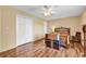 This bedroom features hardwood floors, a ceiling fan, and neutral walls for a cozy feel at 5086 Highway 319 E, Conway, SC 29526