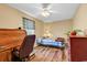 Cozy bedroom featuring a ceiling fan and laminate wood flooring at 5086 Highway 319 E, Conway, SC 29526