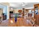Open concept dining room featuring hardwood floors, a view of the living room, and wood accents at 5086 Highway 319 E, Conway, SC 29526
