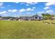 Beautiful home with a well-manicured lawn, back deck, and ample parking space on a sunny day at 5086 Highway 319 E, Conway, SC 29526