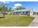Attractive one-story home with attached garage, well-maintained lawn, and metal roof at 5086 Highway 319 E, Conway, SC 29526