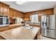 Kitchen island featuring wooden finish with a stainless fridge at 5086 Highway 319 E, Conway, SC 29526