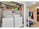 Laundry room featuring washer, dryer, and overhead storage shelves at 5086 Highway 319 E, Conway, SC 29526