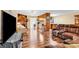 This cozy living room features hardwood floors, a fireplace, and an open concept to the kitchen at 5086 Highway 319 E, Conway, SC 29526