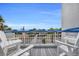 Balcony with views of beach access, palm trees, and the ocean at 5511 N Ocean Blvd. # 203, Myrtle Beach, SC 29577