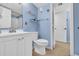 Cozy blue bathroom featuring a white vanity, toilet, and nautical-themed decor at 5511 N Ocean Blvd. # 203, Myrtle Beach, SC 29577