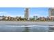 Beachfront view of condos and buildings from the ocean with a sandy beach at 5511 N Ocean Blvd. # 203, Myrtle Beach, SC 29577